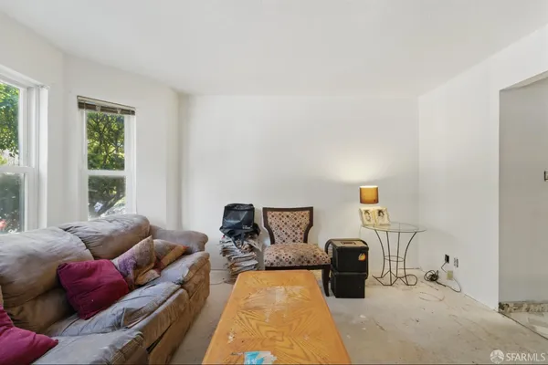 a bedroom with furniture and a bed