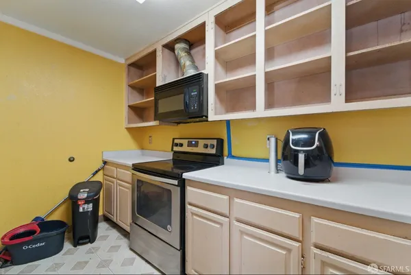 a kitchen with stainless steel appliances granite countertop a sink and a cabinets