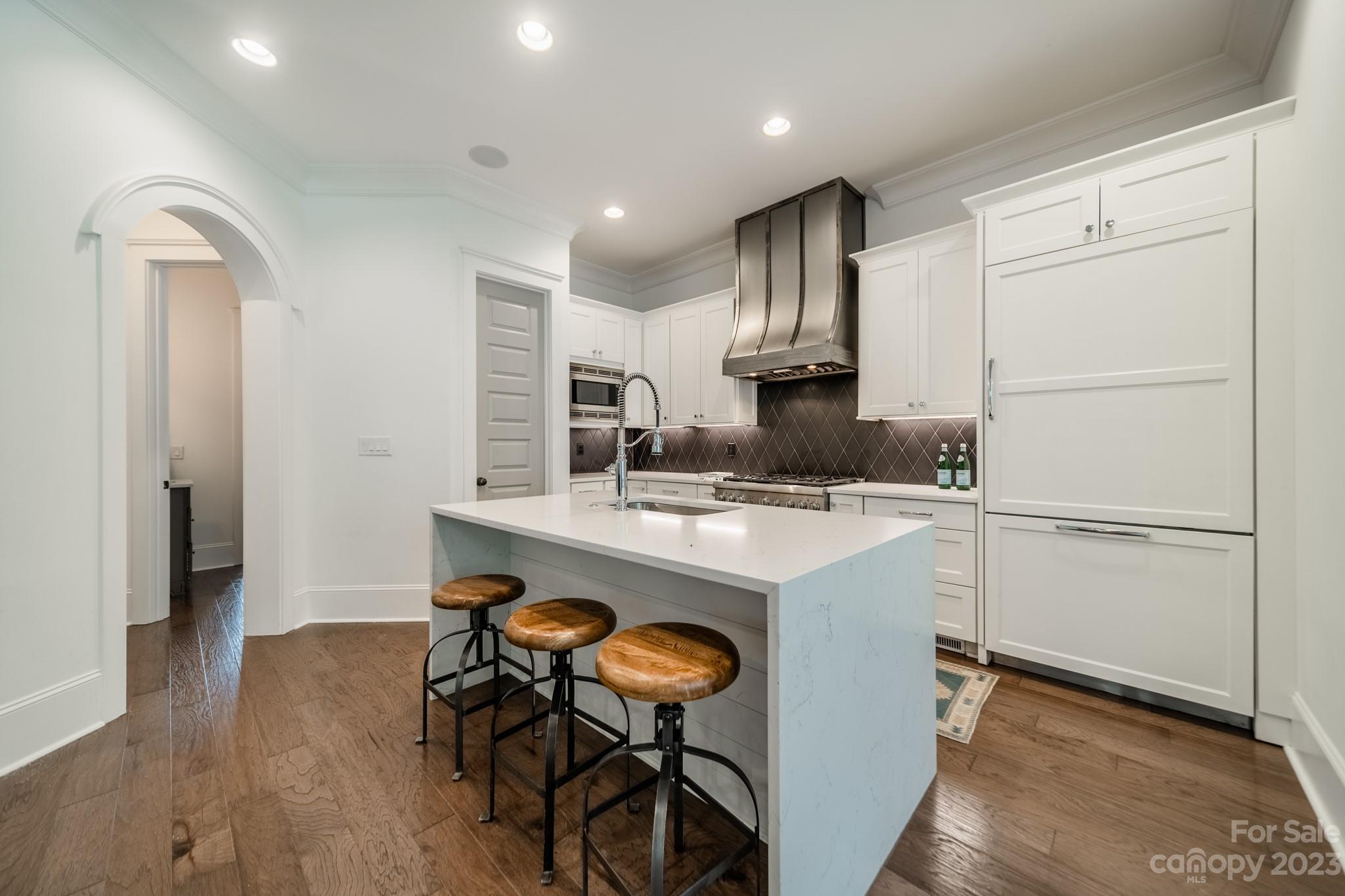744 Ellsworth Road Charlotte, NC 28211 - Photo 17 of 31 a kitchen with kitchen island a stove a sink and a refrigerator