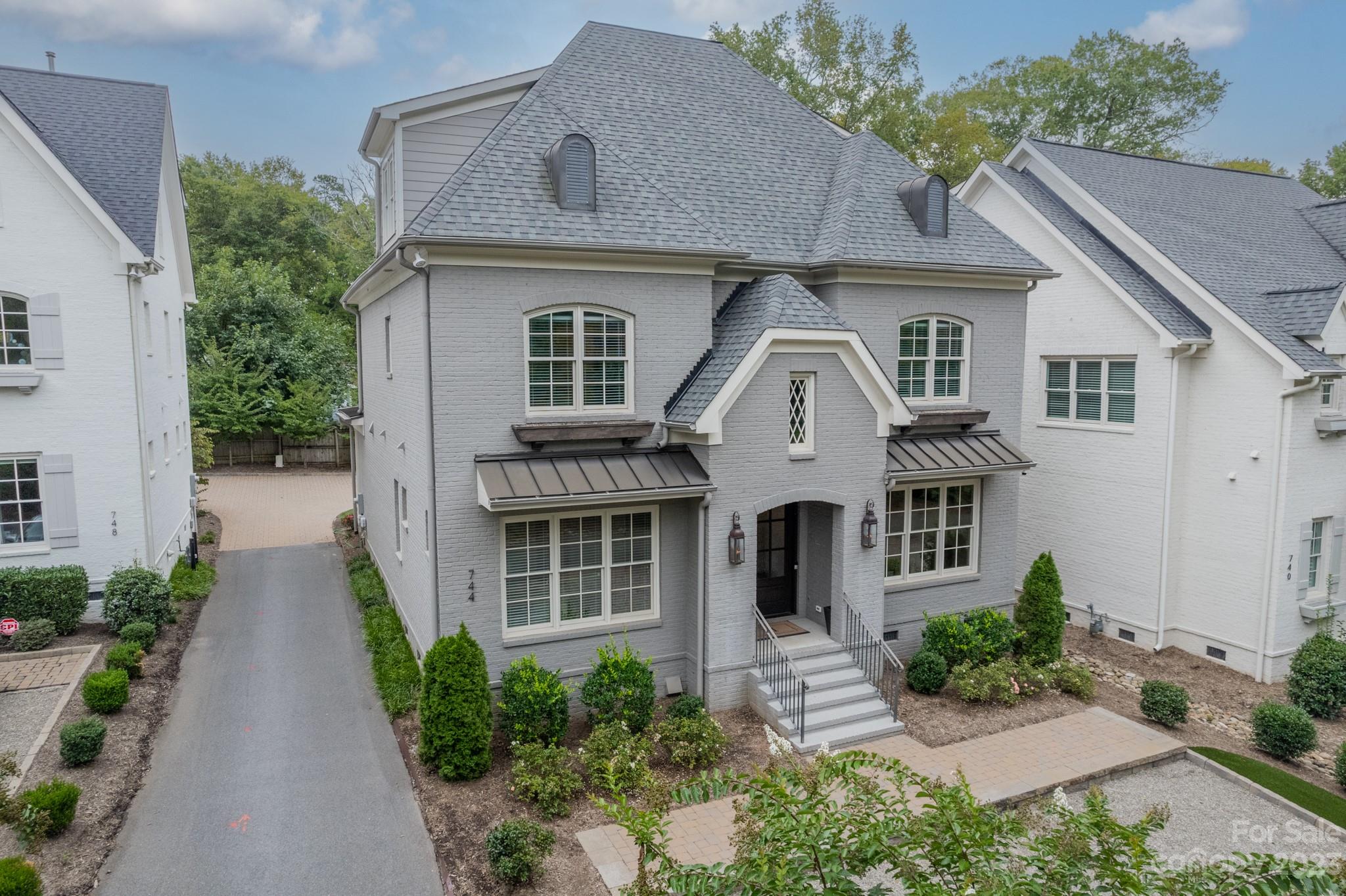 744 Ellsworth Road Charlotte, NC 28211 - Photo 2 of 31 a front view of a house with a yard