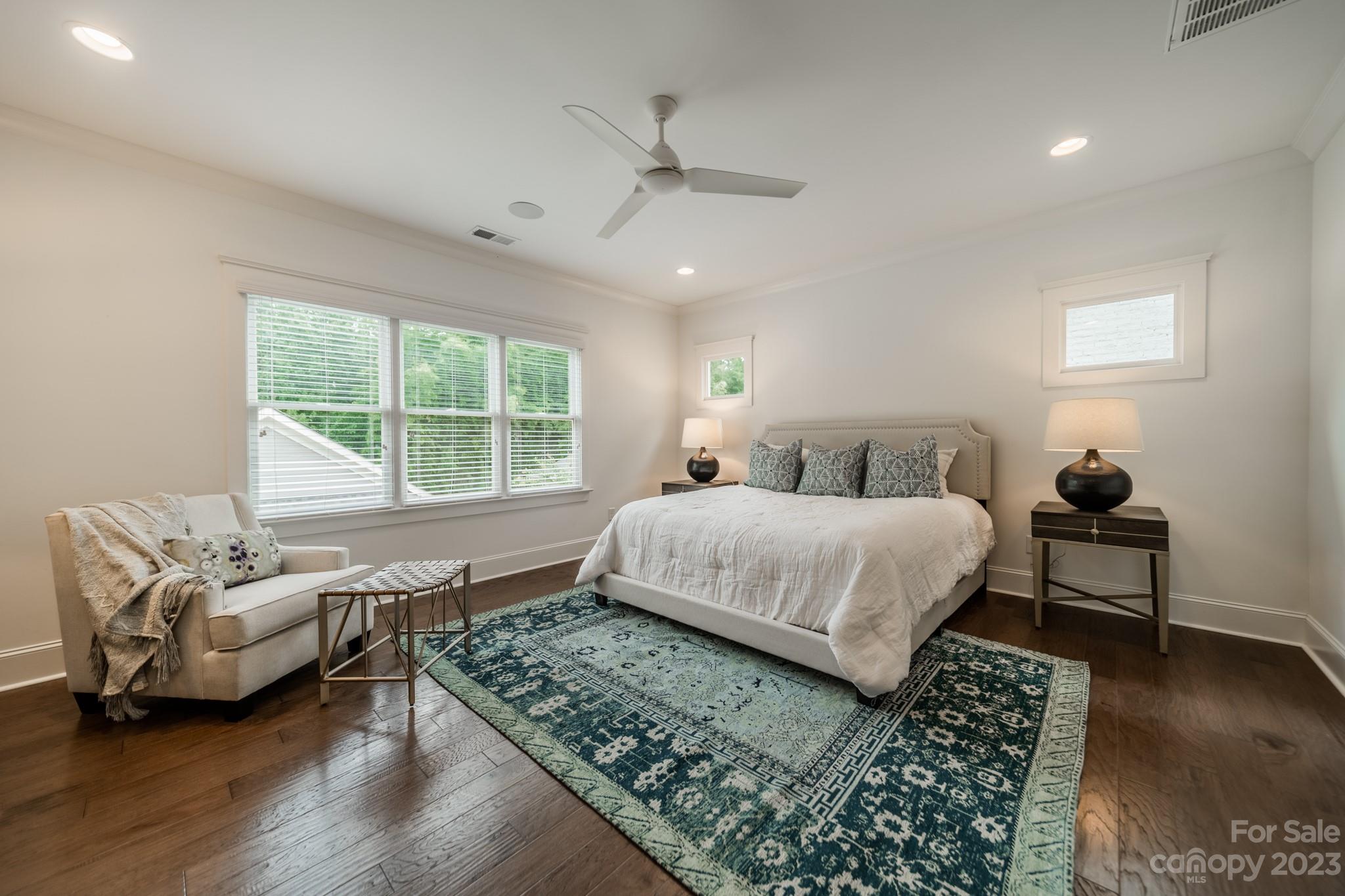 744 Ellsworth Road Charlotte, NC 28211 - Photo 25 of 31 a bedroom with a bed a couch and a window