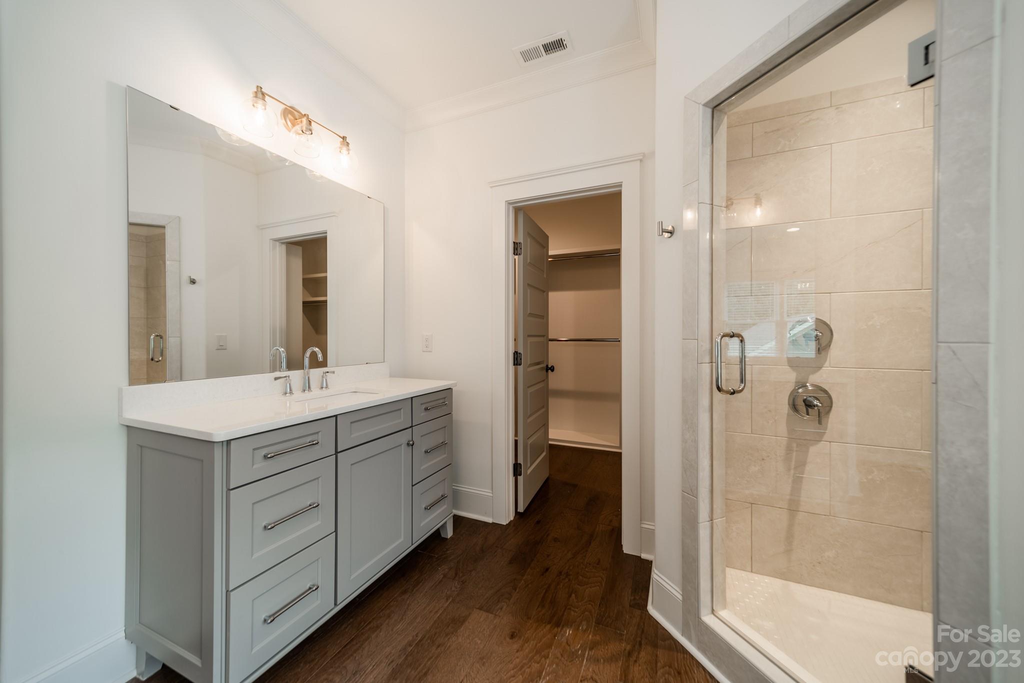 744 Ellsworth Road Charlotte, NC 28211 - Photo 28 of 31 a bathroom with a double vanity sink a toilet and shower