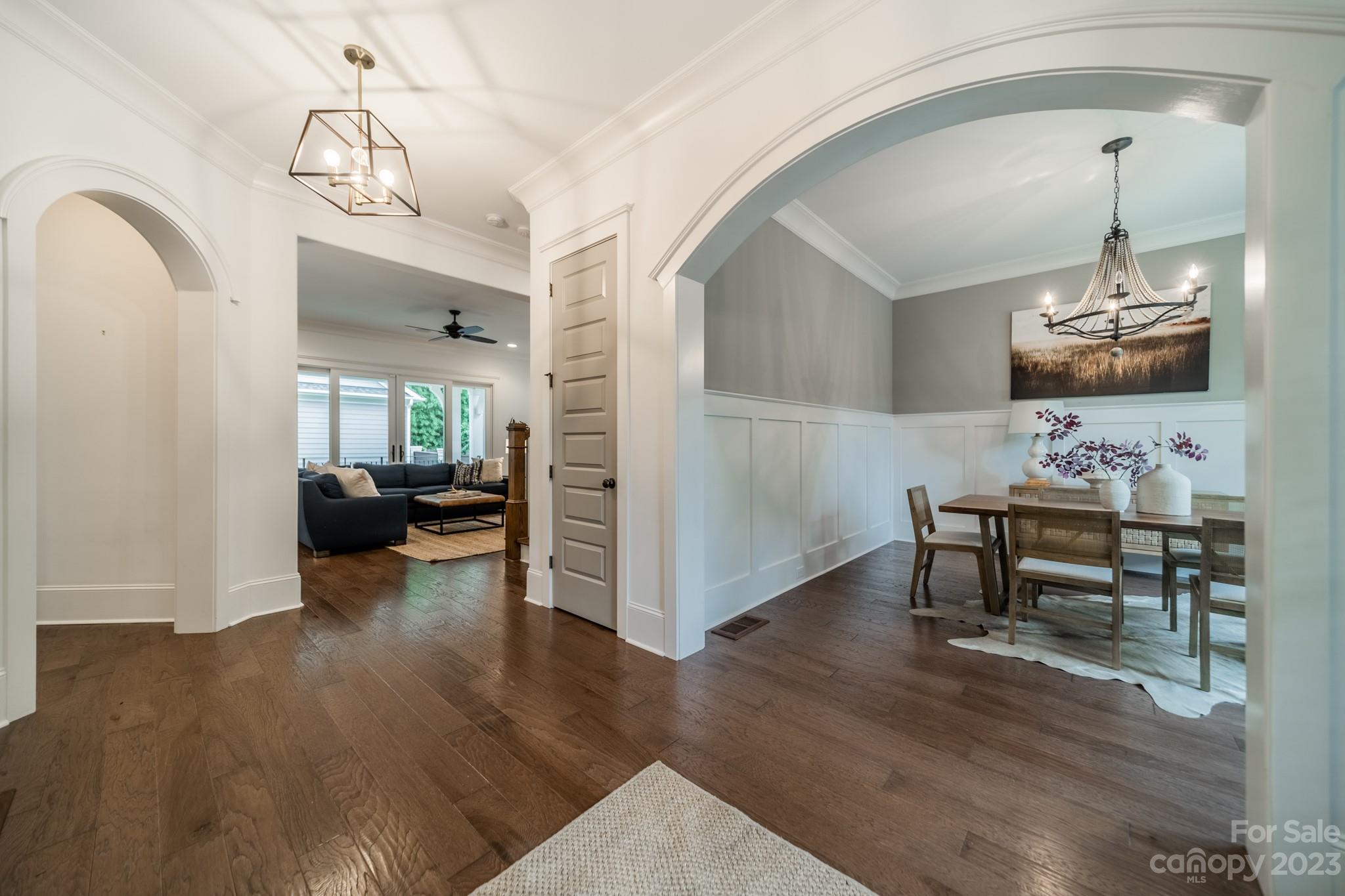 744 Ellsworth Road Charlotte, NC 28211 - Photo 7 of 31 a view of a livingroom kitchen and dining room with wooden floor