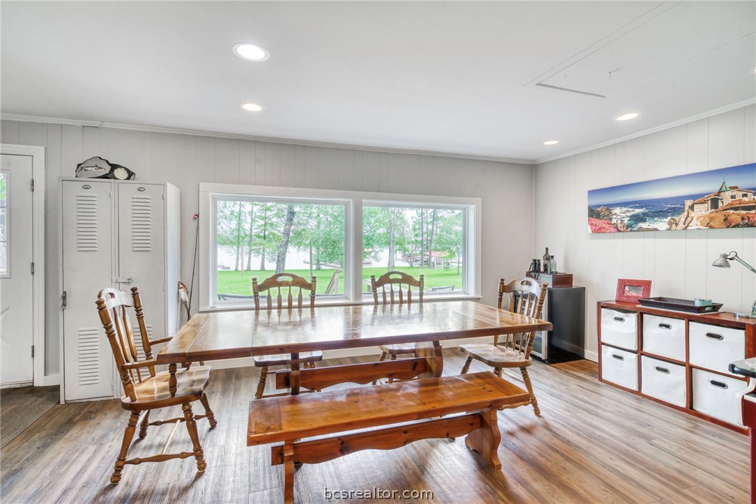 11452 Riley Green Road Franklin, TX 77856 - Photo 7 of 31 a living room with furniture a wooden floor and floor to ceiling window