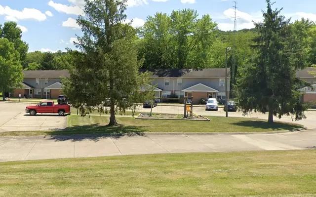 a swimming pool with outdoor seating and yard