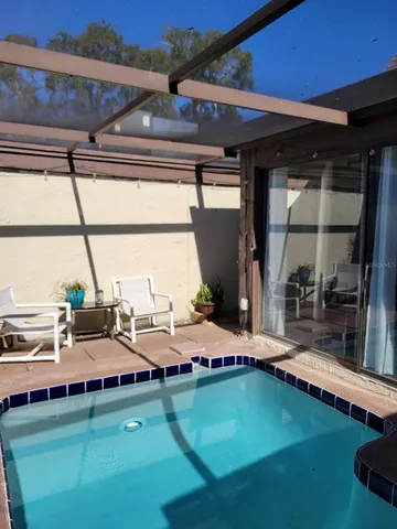 a view of backyard with patio