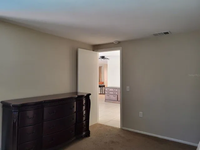 a bathroom with a shower and a sink
