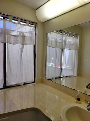 a white refrigerator freezer sitting inside of a kitchen
