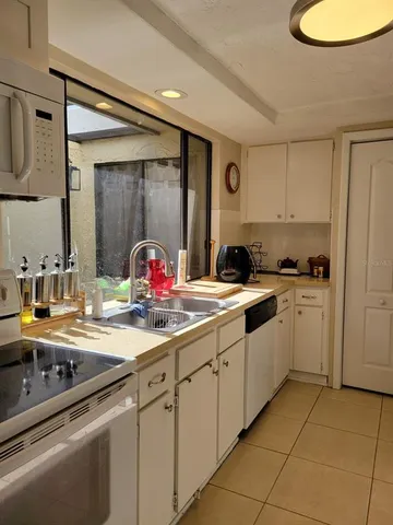 a view of a room with a table and chairs