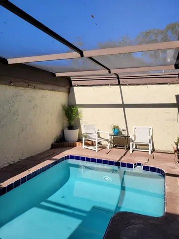 a room with view pool table and chairs