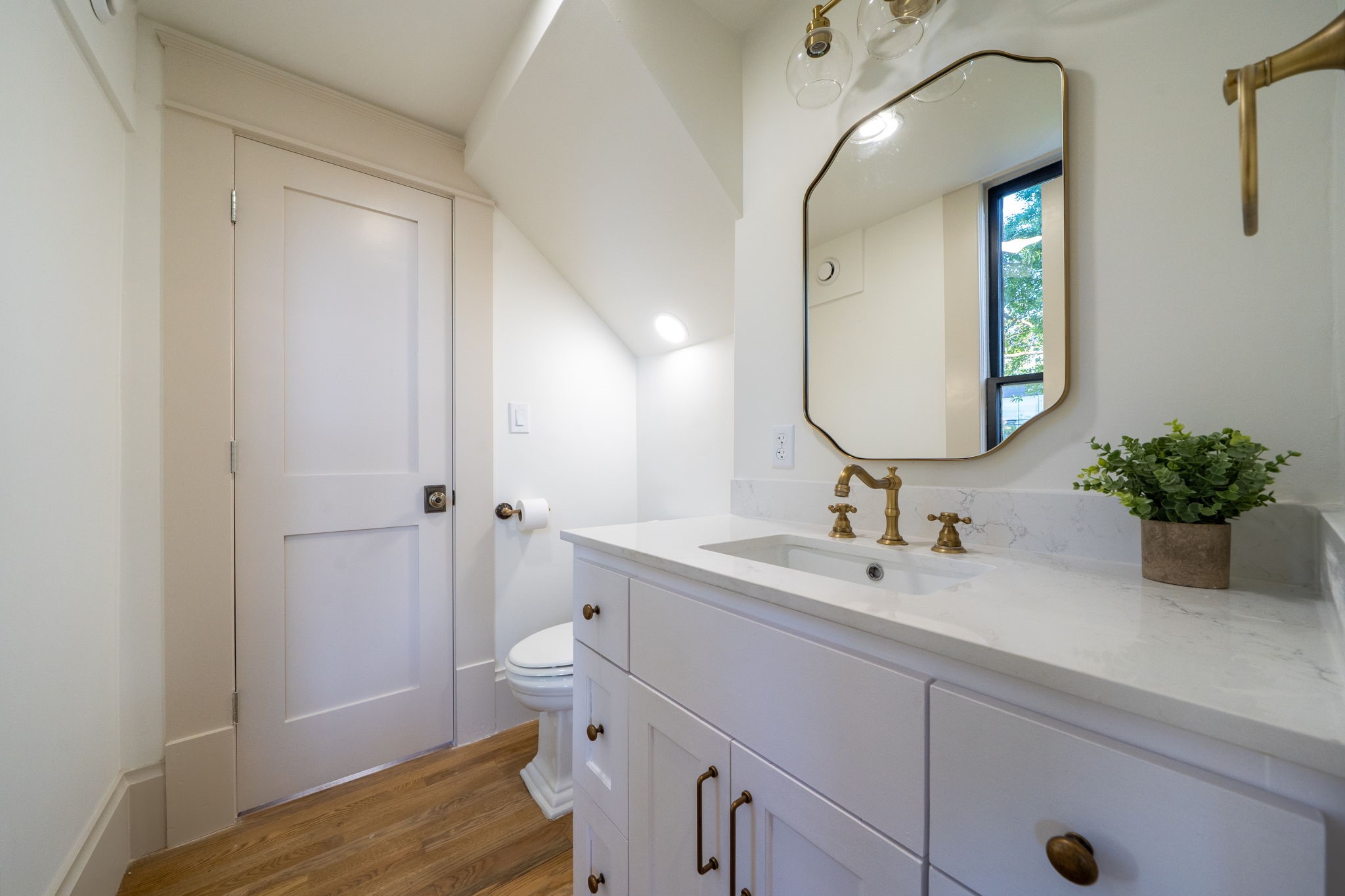 1109 Rutland Street Houston, TX 77008 - Photo 14 of 34 This beautifully relocated half bath is a perfect blend of style and convenience. Highlighted by a sleek new vanity and chic mirror lights that add both function and flair, it’s a space designed to impress. Ideally situated with easy access through the study and family room, this updated retreat is as practical as it is polished.
