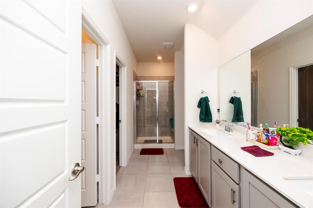 3229 Trails End Road Aubrey, TX 76227 - Photo 11 of 25 Bathroom with double vanity, a shower stall, light tile patterned floors, and recessed lighting