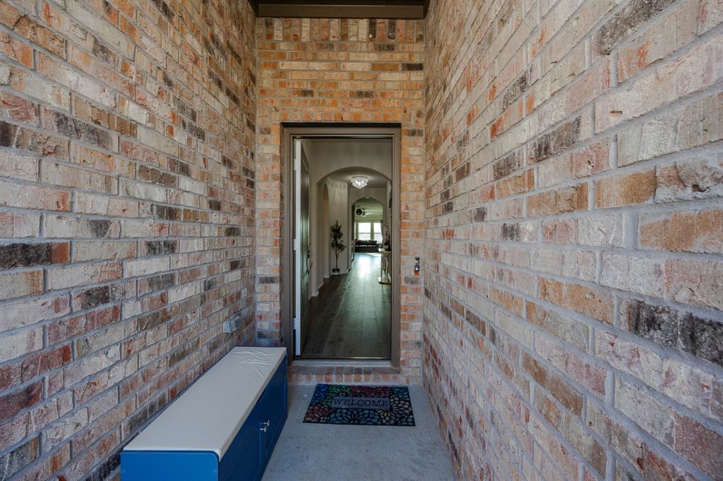 3229 Trails End Road Aubrey, TX 76227 - Photo 5 of 25 Entrance to property featuring brick siding