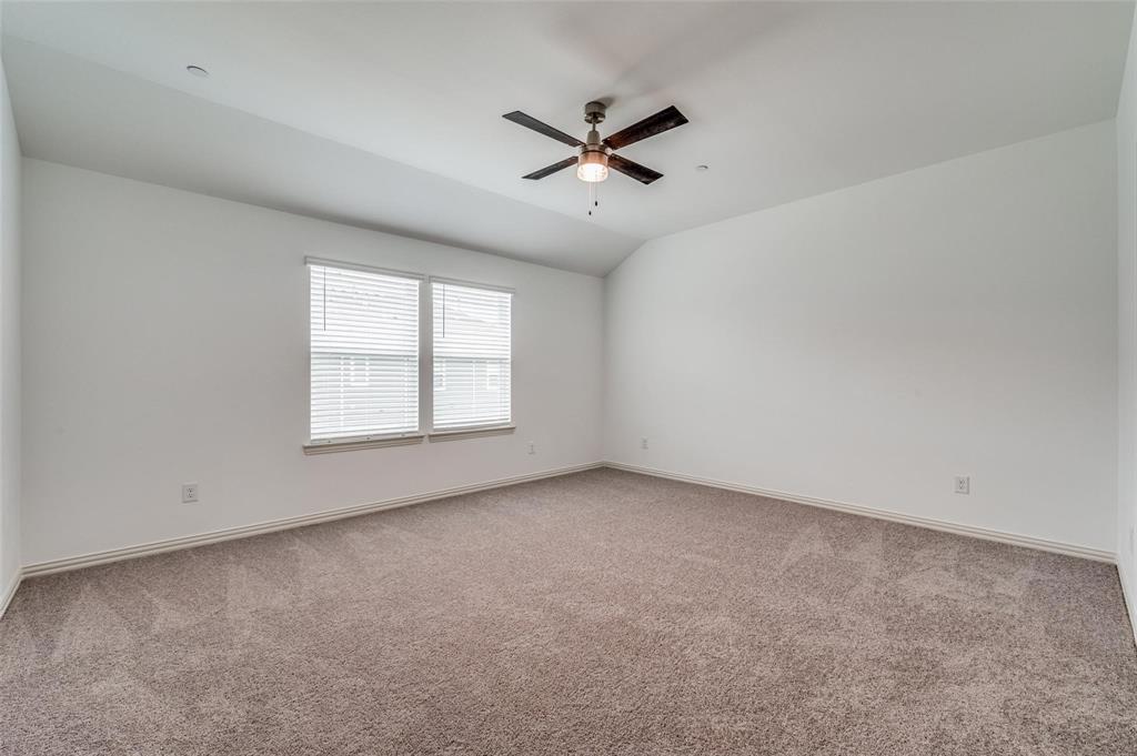 8940 Samara Street Frisco, TX 75035 - Photo 14 of 28 an empty room with a window and a fan