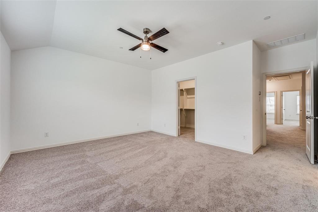 8940 Samara Street Frisco, TX 75035 - Photo 15 of 28 an empty room with closet and a ceiling fan