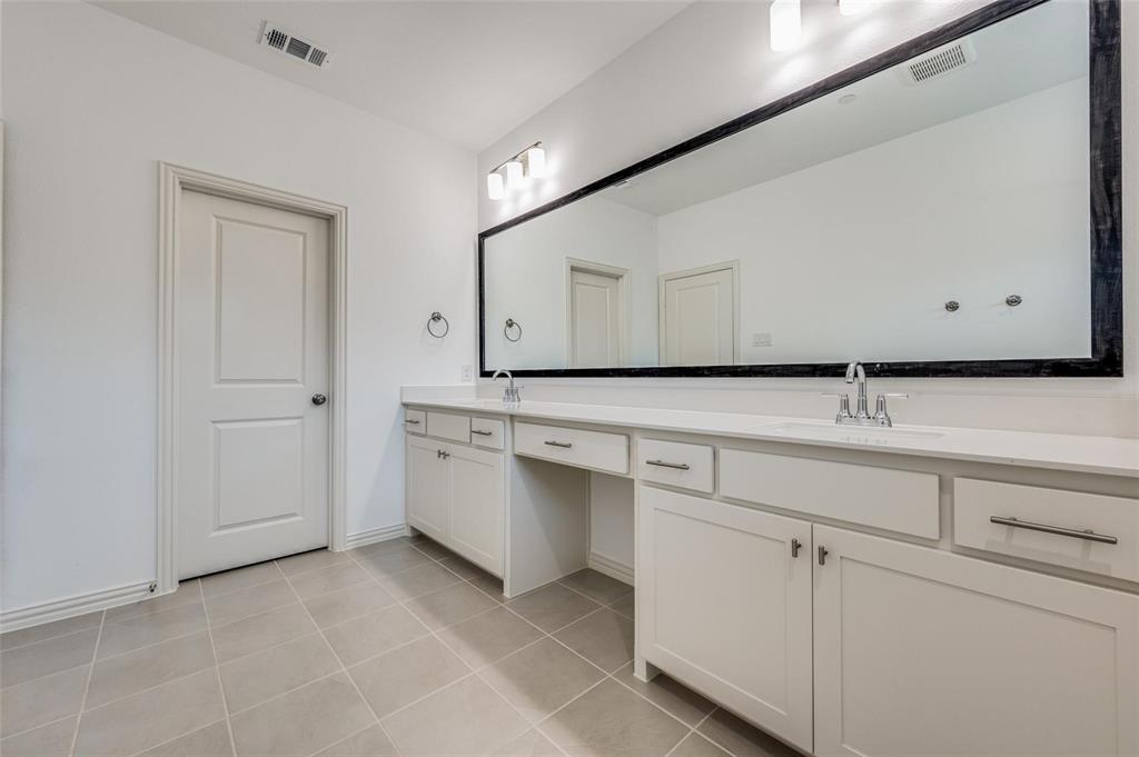 8940 Samara Street Frisco, TX 75035 - Photo 17 of 28 a view of cabinets with sink