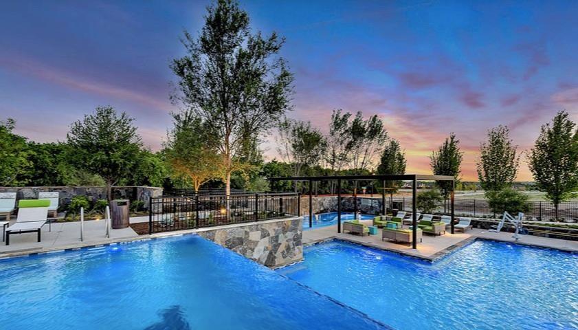 8940 Samara Street Frisco, TX 75035 - Photo 25 of 28 a view of a swimming pool with sitting area