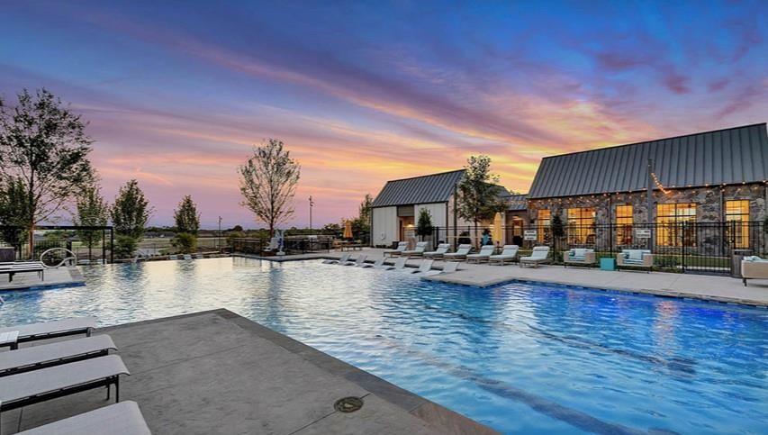 8940 Samara Street Frisco, TX 75035 - Photo 26 of 28 a view of a swimming pool with outdoor seating and yard