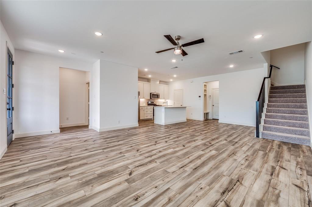8940 Samara Street Frisco, TX 75035 - Photo 5 of 28 a view of empty room with wooden floor and window