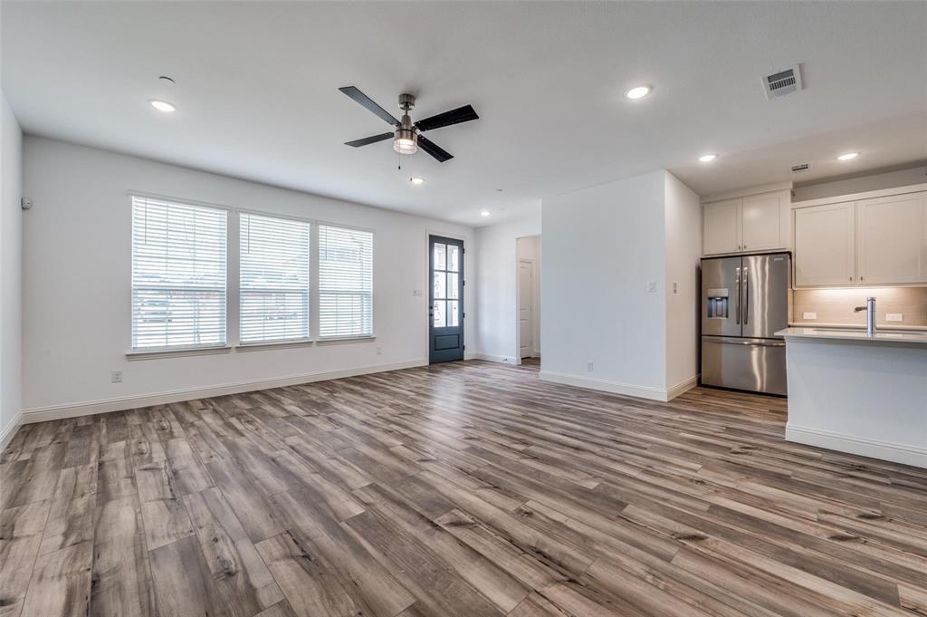 8940 Samara Street Frisco, TX 75035 - Photo 7 of 28 a view of empty room with wooden floor and window