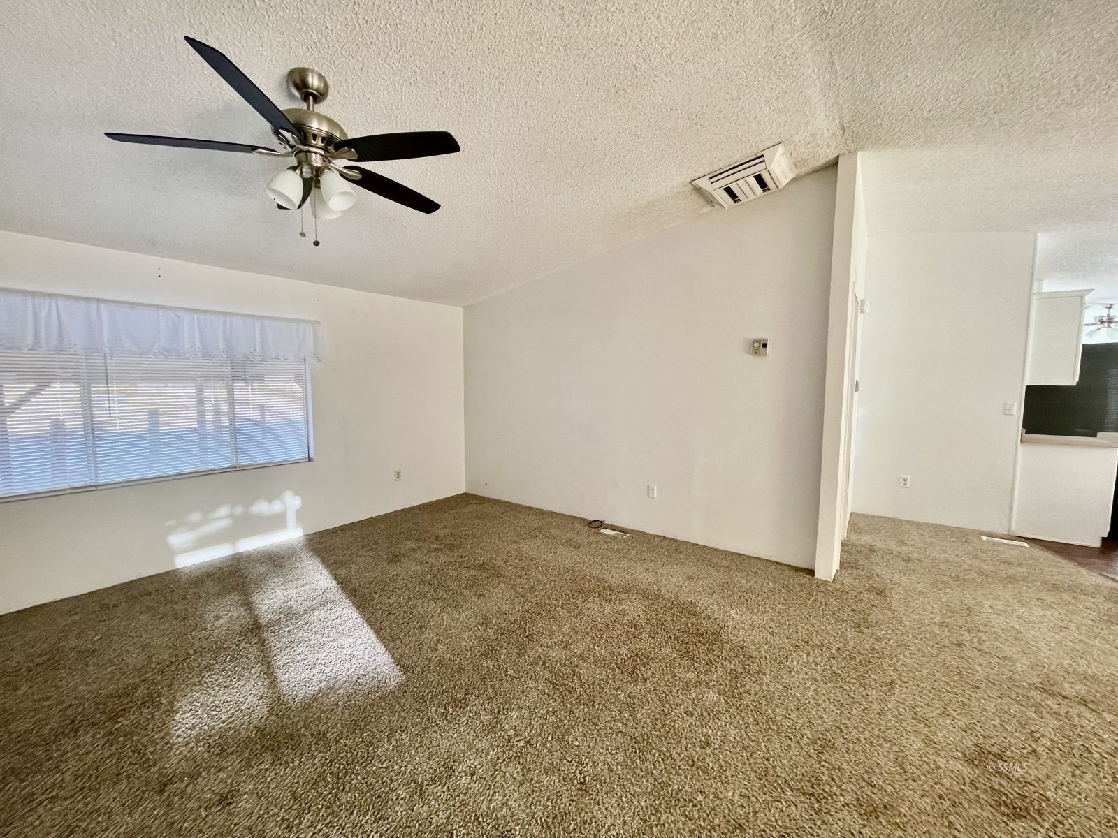 1465 Pony Street Ridgecrest, CA 93555 - Photo 26 of 32 a view of a room with a ceiling fan