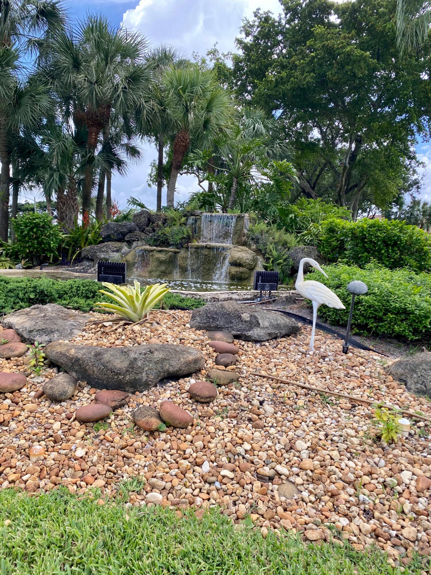 9170 Southwest 14th Street, Unit 4405 Boca Raton, FL 33428 - Photo 47 of 48 a view of a backyard with swimming pool