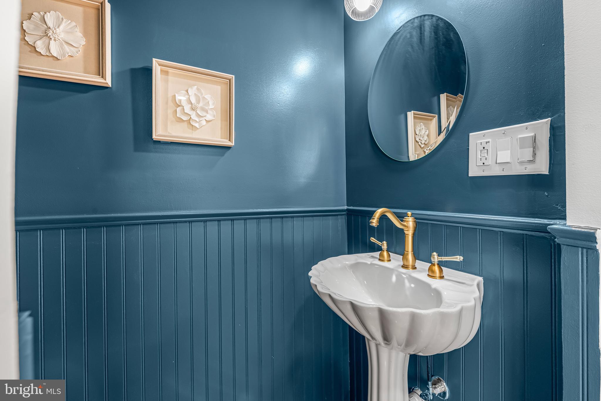 177 V Street Northeast Washington, DC 20002 - Photo 15 of 32 a bathroom with a sink and a mirror