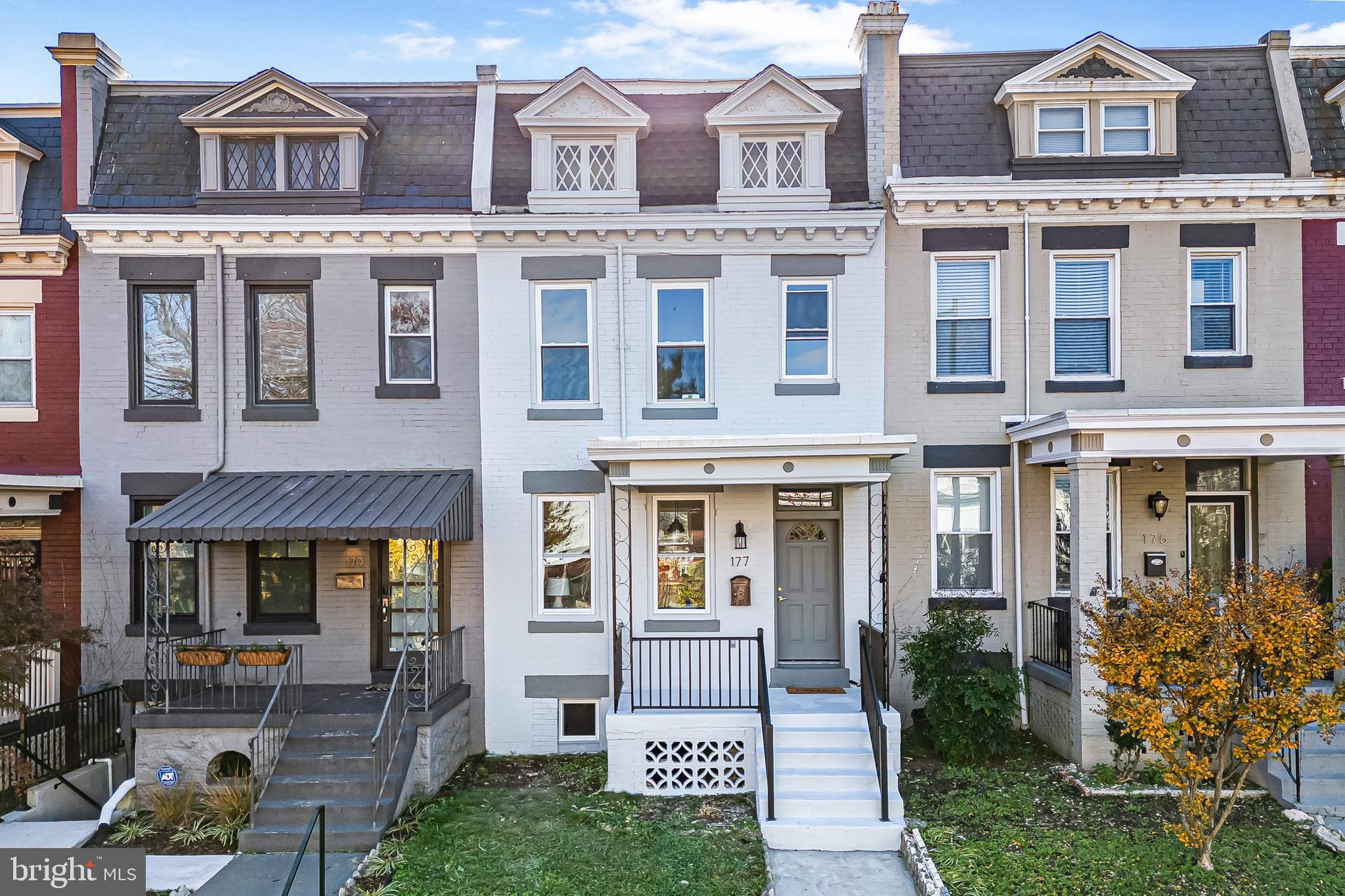 177 V Street Northeast Washington, DC 20002 - Photo 2 of 32 front view of a brick house with a yard