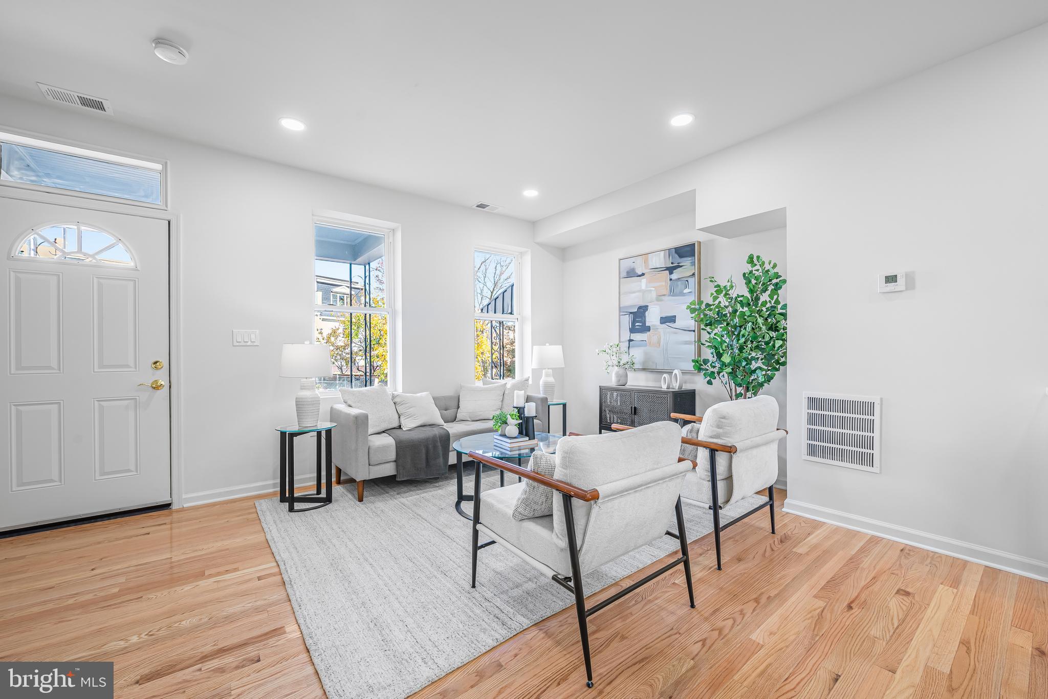 177 V Street Northeast Washington, DC 20002 - Photo 6 of 32 a living room with furniture and wooden floor