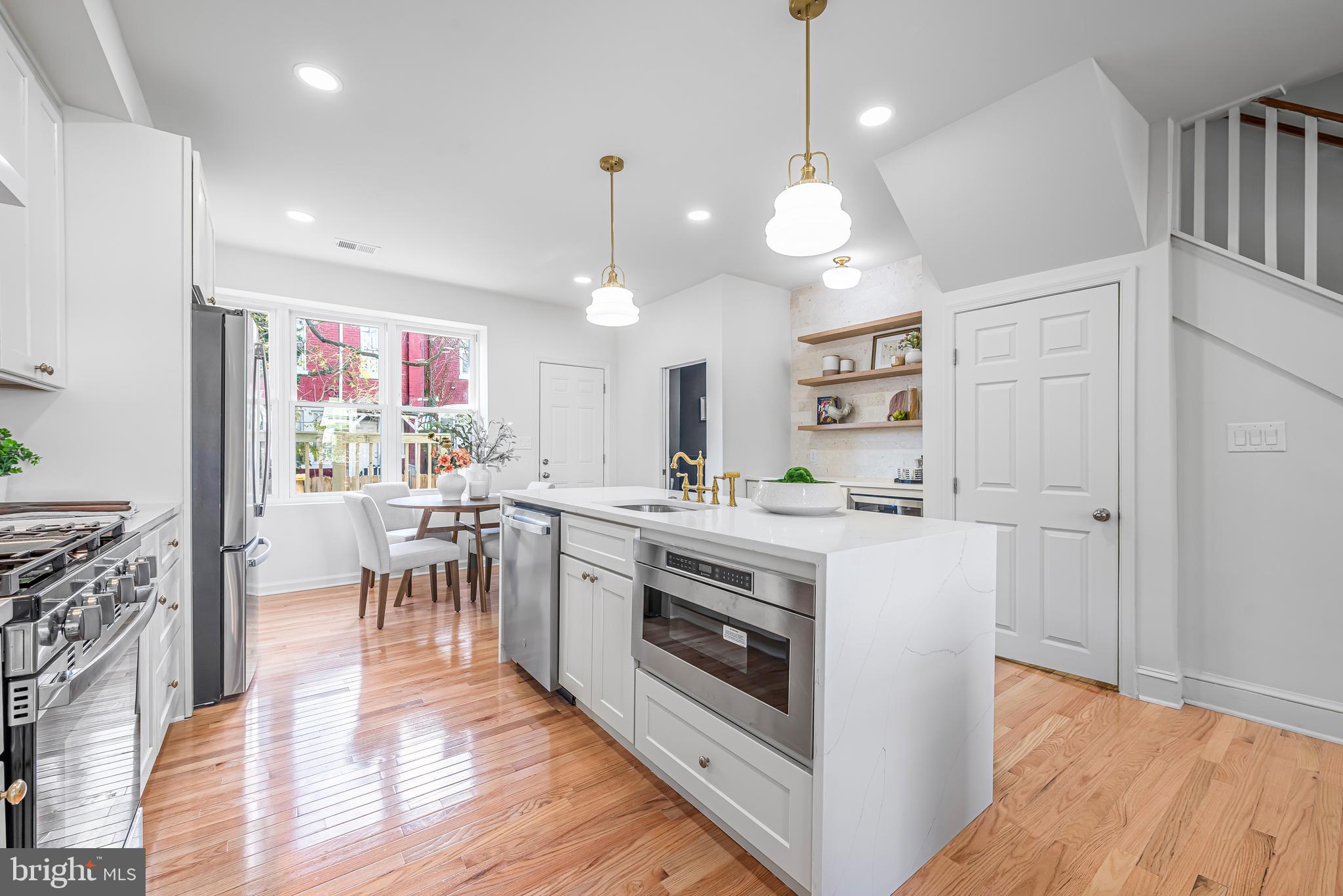 177 V Street Northeast Washington, DC 20002 - Photo 9 of 32 a kitchen with a stove and a refrigerator