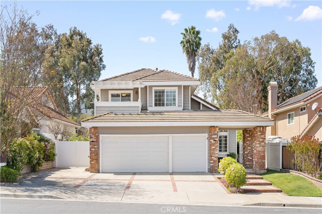 15722 Live Oak Road Chino Hills, CA 91709 - Photo 1 of 1 a front view of a house with garden