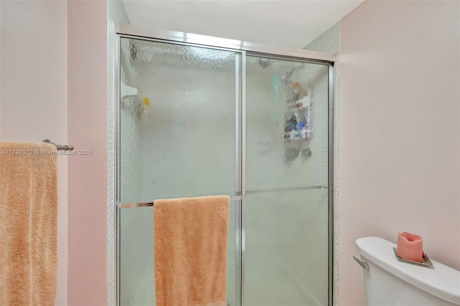 7080 Environ Boulevard, Unit 223 Lauderhill, FL 33319 - Photo 16 of 36 a bathroom with a shower and a toilet