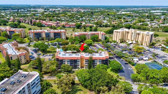 an aerial view of a houses with yard
