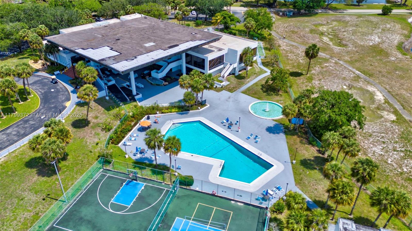 7080 Environ Boulevard, Unit 223 Lauderhill, FL 33319 - Photo 35 of 36 an aerial view of a house with a swimming pool outdoor seating