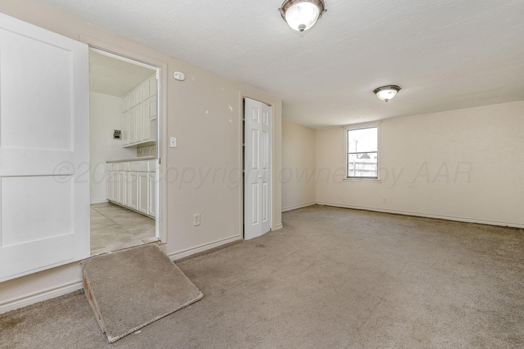 4004 South Van Buren Street Amarillo, TX 79110 - Photo 13 of 17 a view of an empty room with a window