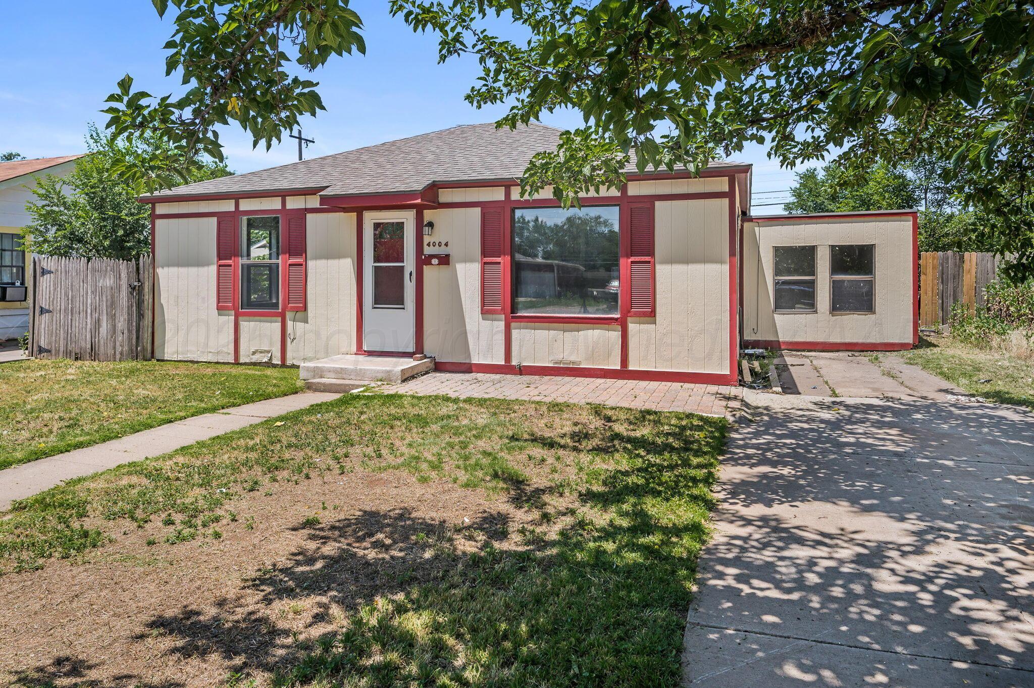 4004 South Van Buren Street Amarillo, TX 79110 - Photo 14 of 17 front view of a house with a yard