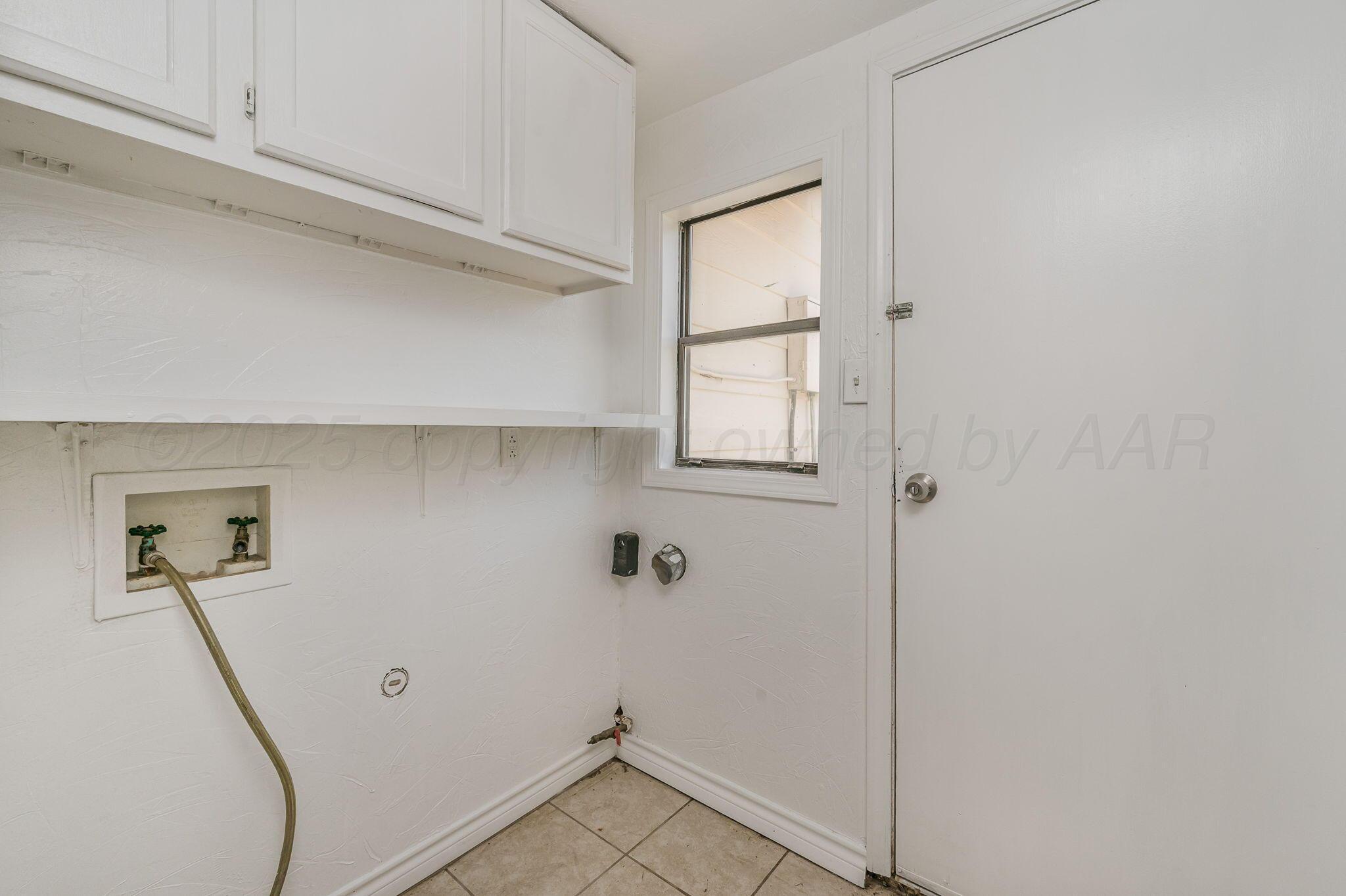 4004 South Van Buren Street Amarillo, TX 79110 - Photo 15 of 17 a view of room with hardwood floor and window