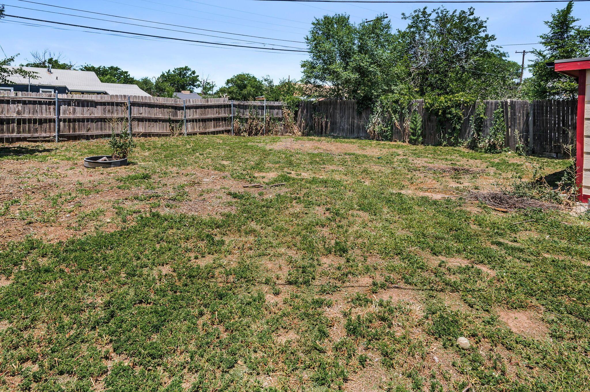 4004 South Van Buren Street Amarillo, TX 79110 - Photo 16 of 17 a backyard of a house with lots of green space