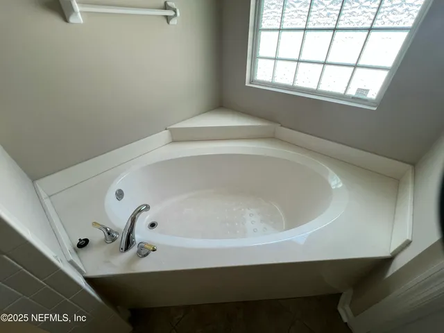 a close view of a bathtub in a bathroom