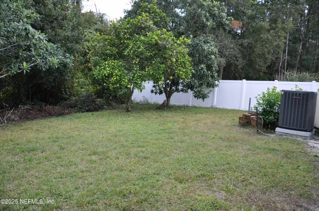 a backyard of a house with lots of green space