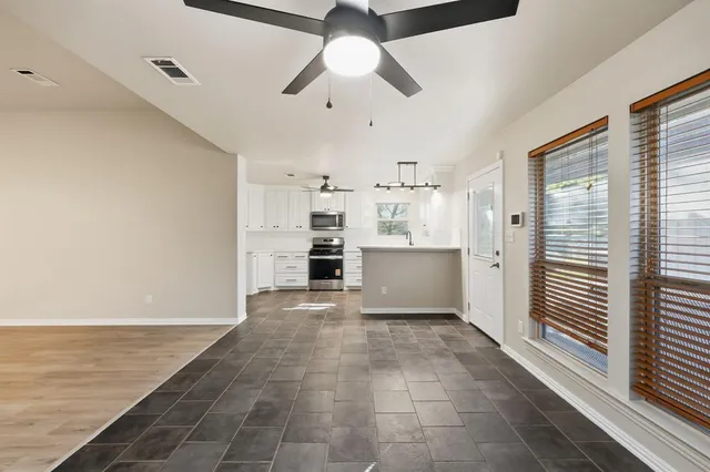 a view of kitchen with furniture and window