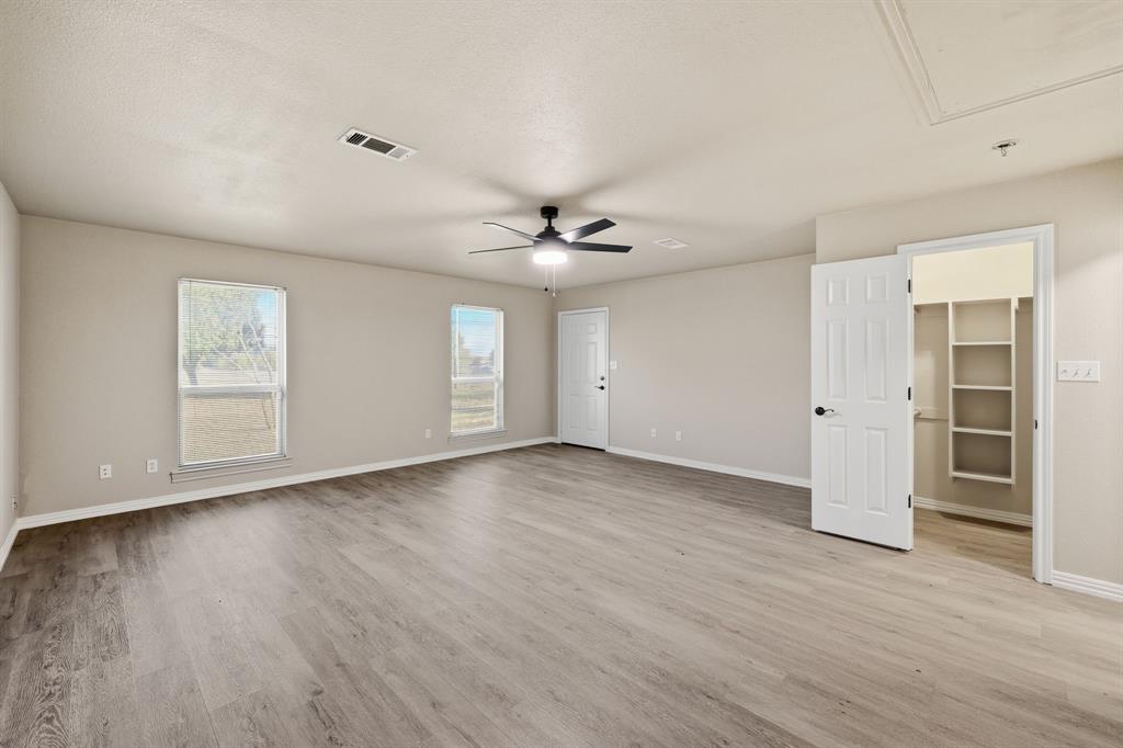 8875 Fm 2450 Sanger, TX 76266 - Photo 20 of 28 an empty room with wooden floor and window
