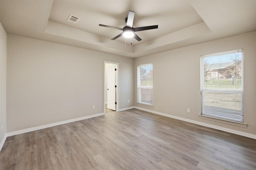 8875 Fm 2450 Sanger, TX 76266 - Photo 21 of 28 wooden floor in an empty room with a window