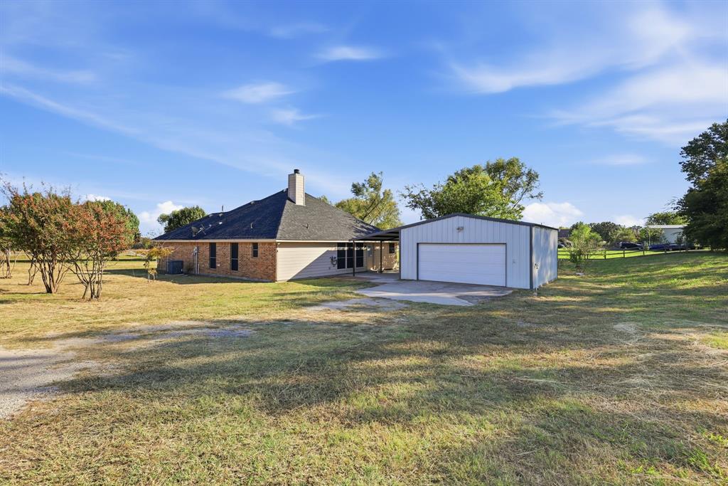 8875 Fm 2450 Sanger, TX 76266 - Photo 26 of 28 a view of a house with a yard