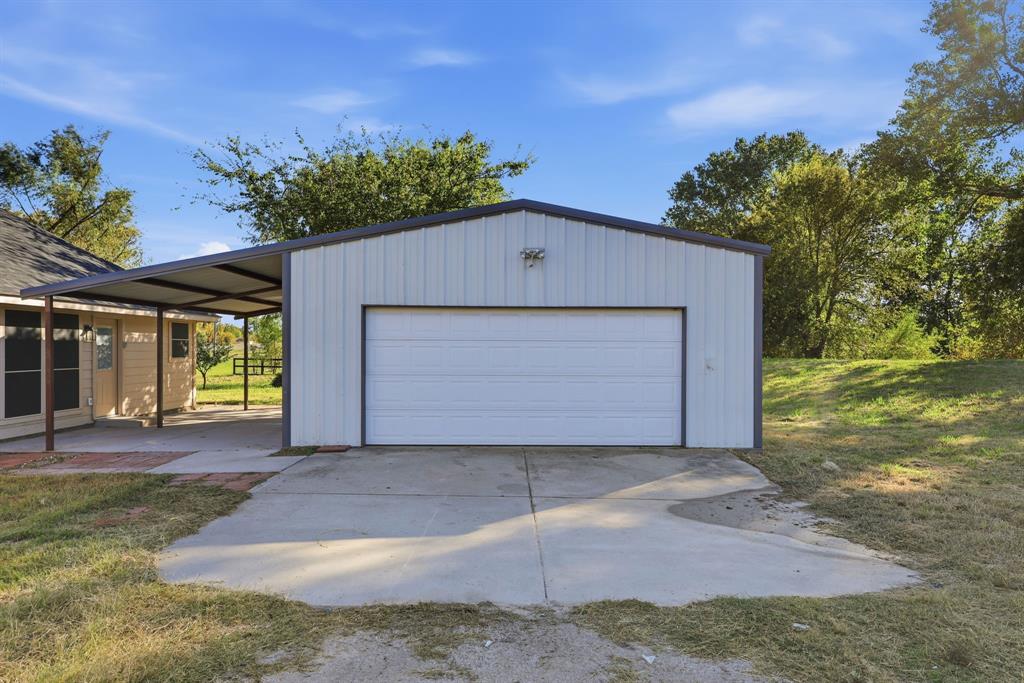 8875 Fm 2450 Sanger, TX 76266 - Photo 27 of 28 a front view of house with yard and trees in the background