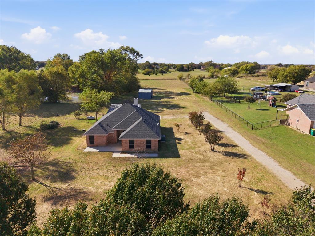 8875 Fm 2450 Sanger, TX 76266 - Photo 4 of 28 a view of a house with a yard and lake view