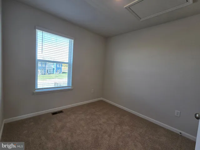 an empty room with closet area