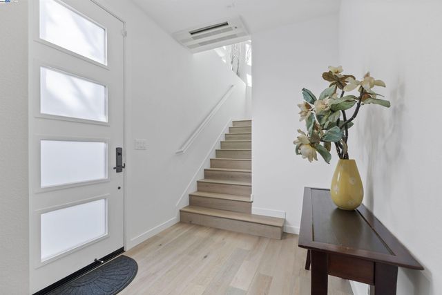 a view of entryway with wooden floor