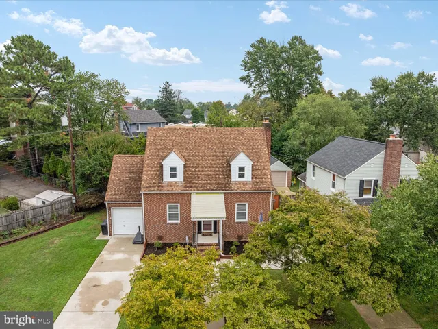 a aerial view of a house with a yard