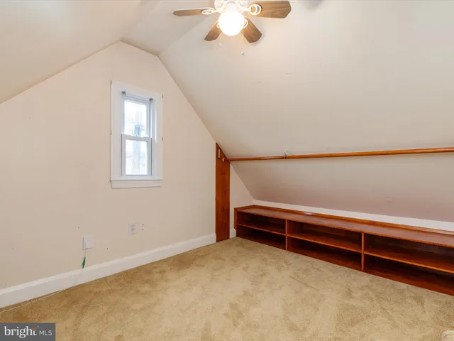a view of room with window and ceiling fan